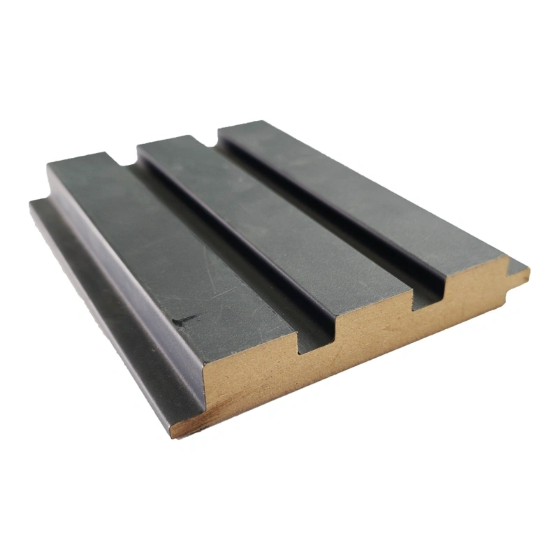 Grooved MDF profile cross-section with a dark decorative surface finish Grooved MDF profile cross-section with a dark decorative surface finish